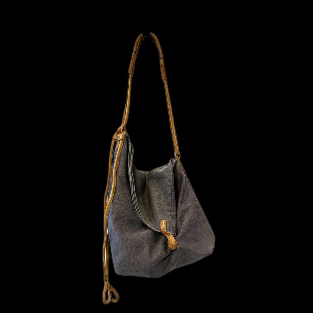 Canvas and leather asymmetrical and adjustable bag